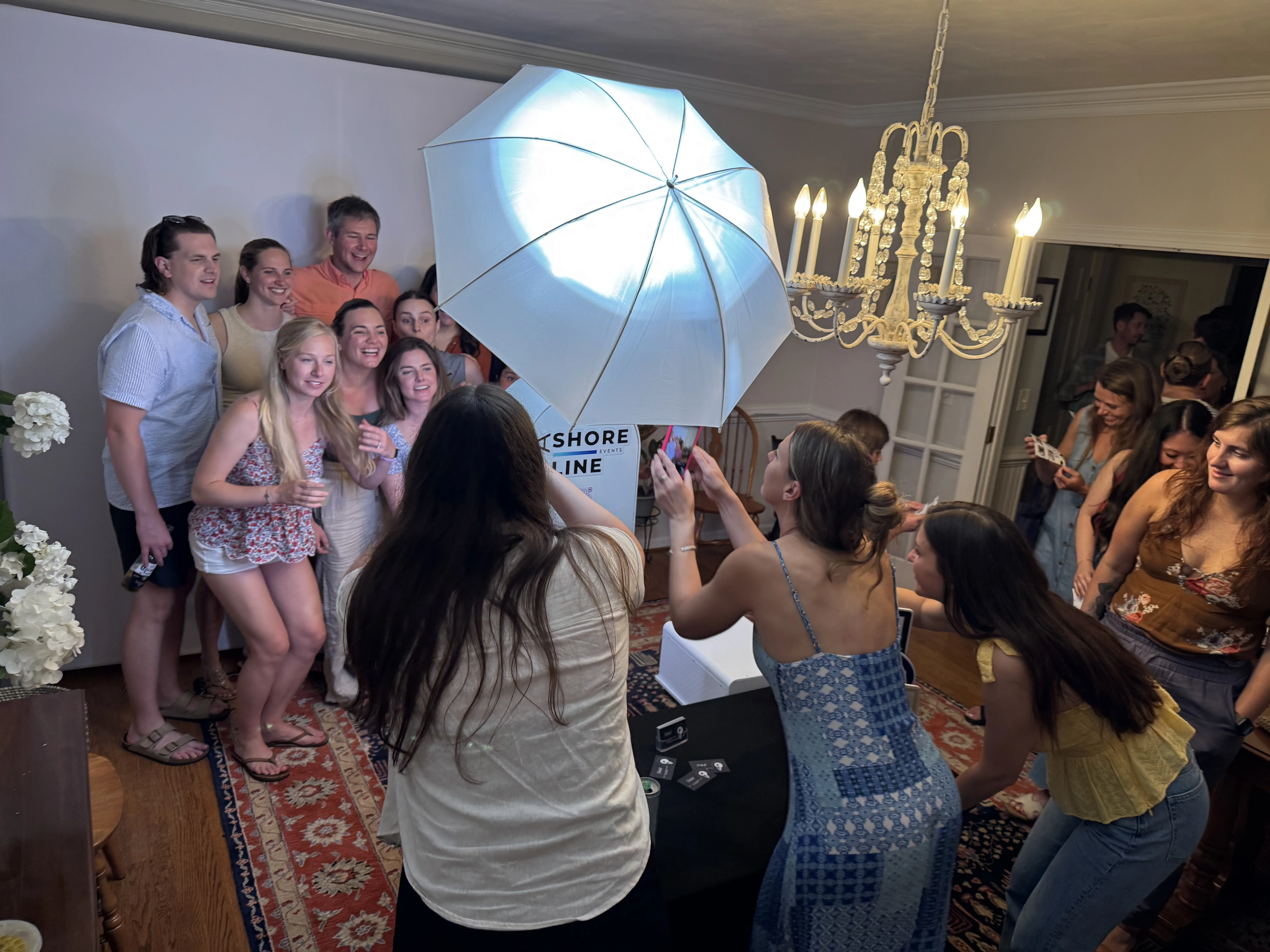 Photo booth guests crowding around DSLR booth at Virginia Beach party — VA Shoreline Events